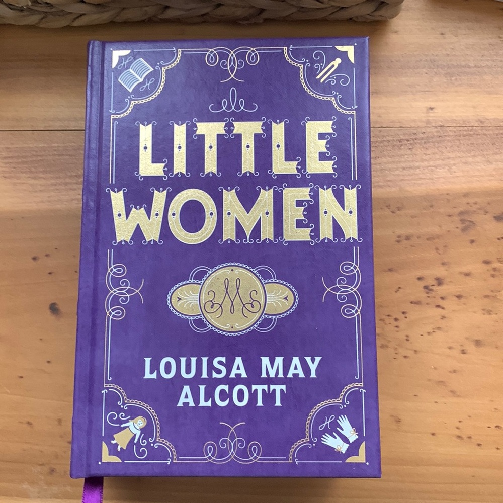 Hardcover book: Little Women by Louisa May Alcott.
